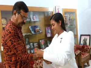 B.K. Reena tying Rakhi to  Member of the Legislative Assembly of Madhya Pradesh Jeetendra Singh Bundela